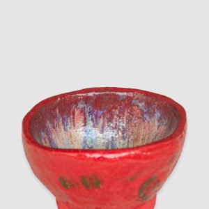 Discover the Kattu Coccinella Ceramic Bowl, featuring a red exterior with a burn effect, blue ripple inside, and a natural burning glaze. Australian-made ceramic bowl with a red exterior and burn effect, featuring a blue ripple design inside on a white background with a natural burning glaze.