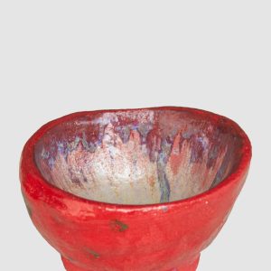 Discover the Kattu Coccinella Ceramic Bowl, featuring a red exterior with a burn effect, blue ripple inside, and a natural burning glaze. Australian-made ceramic bowl with a red exterior and burn effect, featuring a blue ripple design inside on a white background with a natural burning glaze.