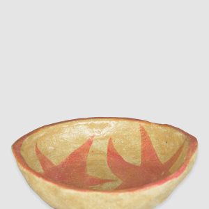 Australian-made ceramic bowl with a natural burnt glaze background and hand-painted pink stars connected in an artistic design.