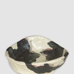 Discover the Kattu Moo Ceramic Dish, inspired by the soft, organic forms of nature, it features a striking black-and-cream pattern of interlocking cloud-like bubbles. Handcrafted in Australia, perfect for trinkets, jewellery, or as a decorative accent.